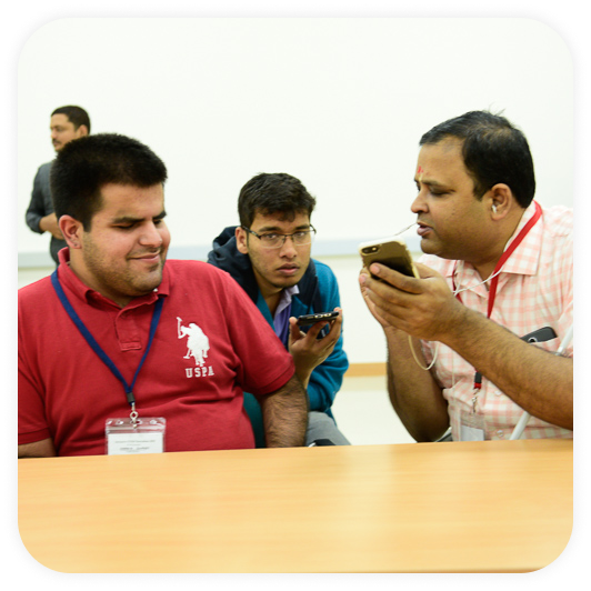 Image of the co-founder - Kartik Sawhney and a blind person accessing I-Stem programs